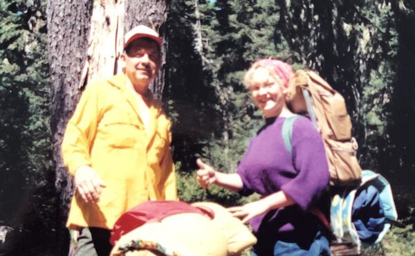 grandpa and Cori in the forest with overnight packs