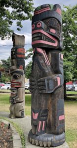 two wooden carved totem poles